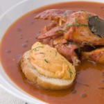 Bowl of Lobster Bisque Rouille Croute and Sliced Truffle